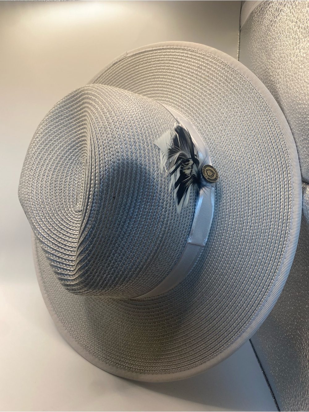 Elegant White Wide-Brim Straw Hat with Feather Accent